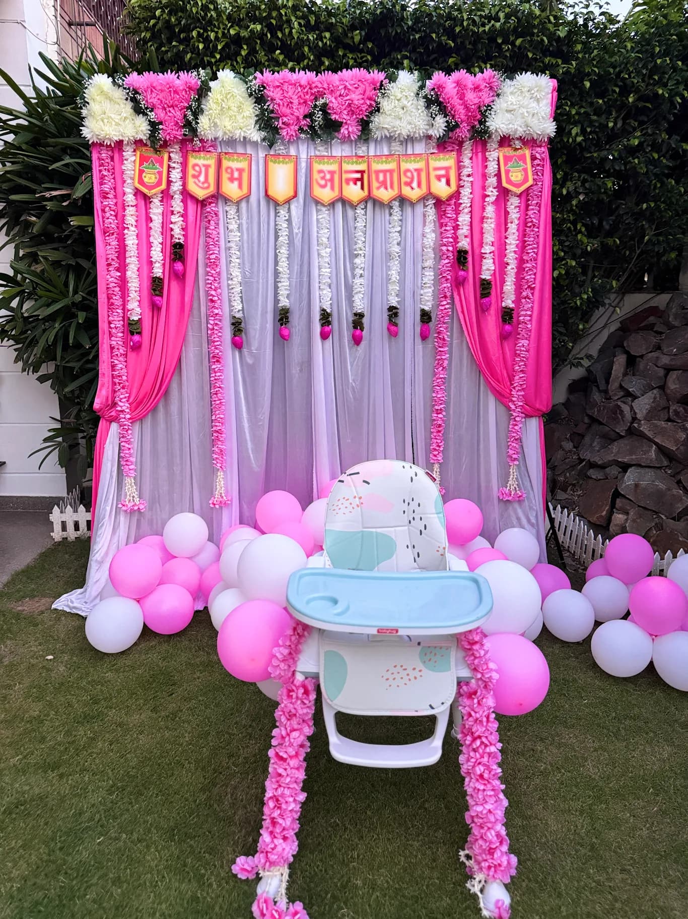 Annaprashan Balloon Decor With Floral Drapes And Baby Chair setup in Faridabad