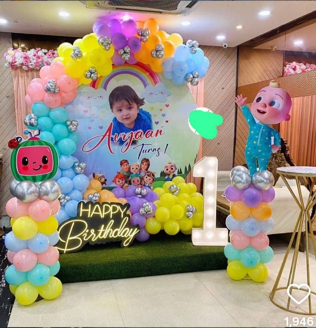 Avyaan Turns One Pastel Rainbow Balloon Decor With Cartoon Characters