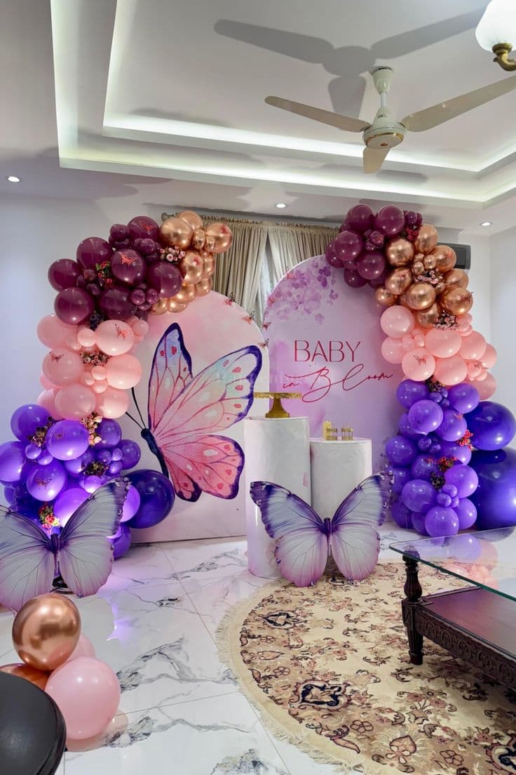 BABY In Bloom Butterfly Balloon Decor With Pastel Arch And White Pedestals
