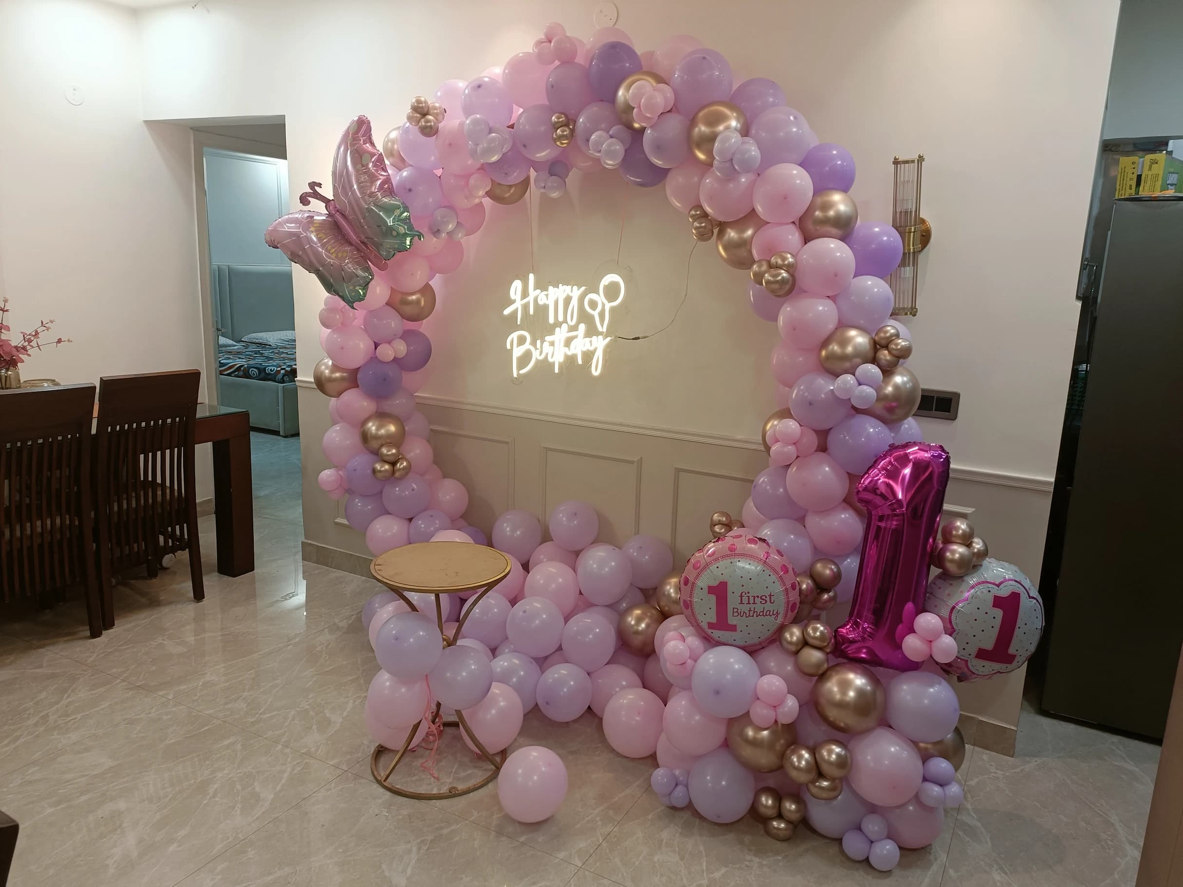Baby Girl 1st Birthday Balloon Decoration With Pink Lavender Arch And LED Backdrop setup in Faridabad