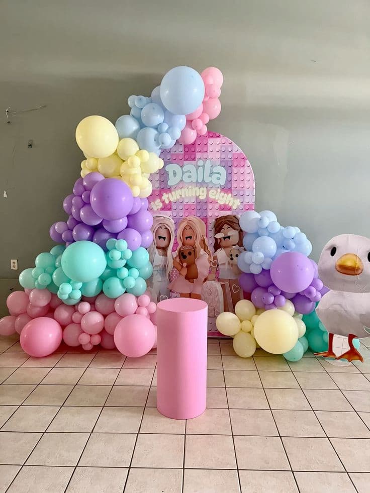 Daila Is Turning Eight Pastel Balloon Decor With LEGO-Style Backdrop And Cartoon Bird