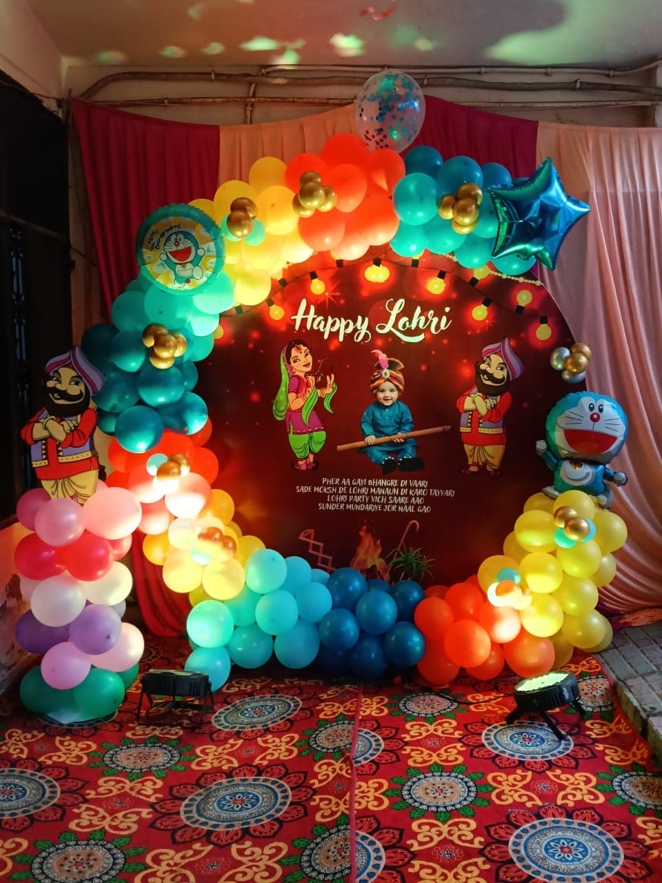 Happy Lohri Balloon Decor With Punjabi Characters And Doraemon For Festive Celebration