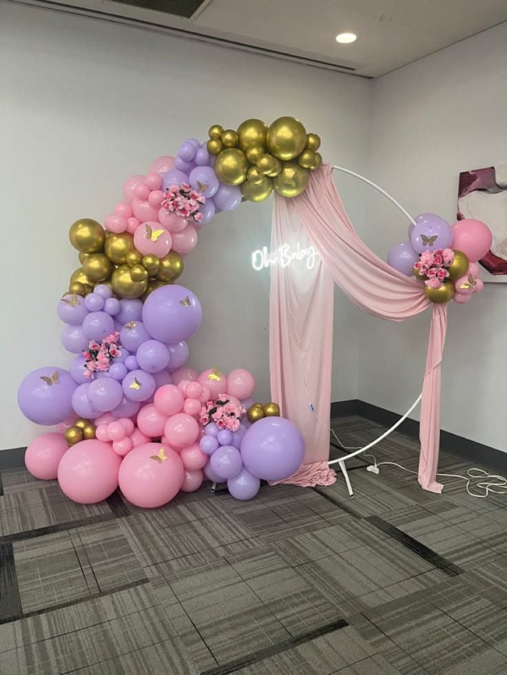 Oh Baby Pastel Balloon Decor With Butterfly Accents And Draped Fabric