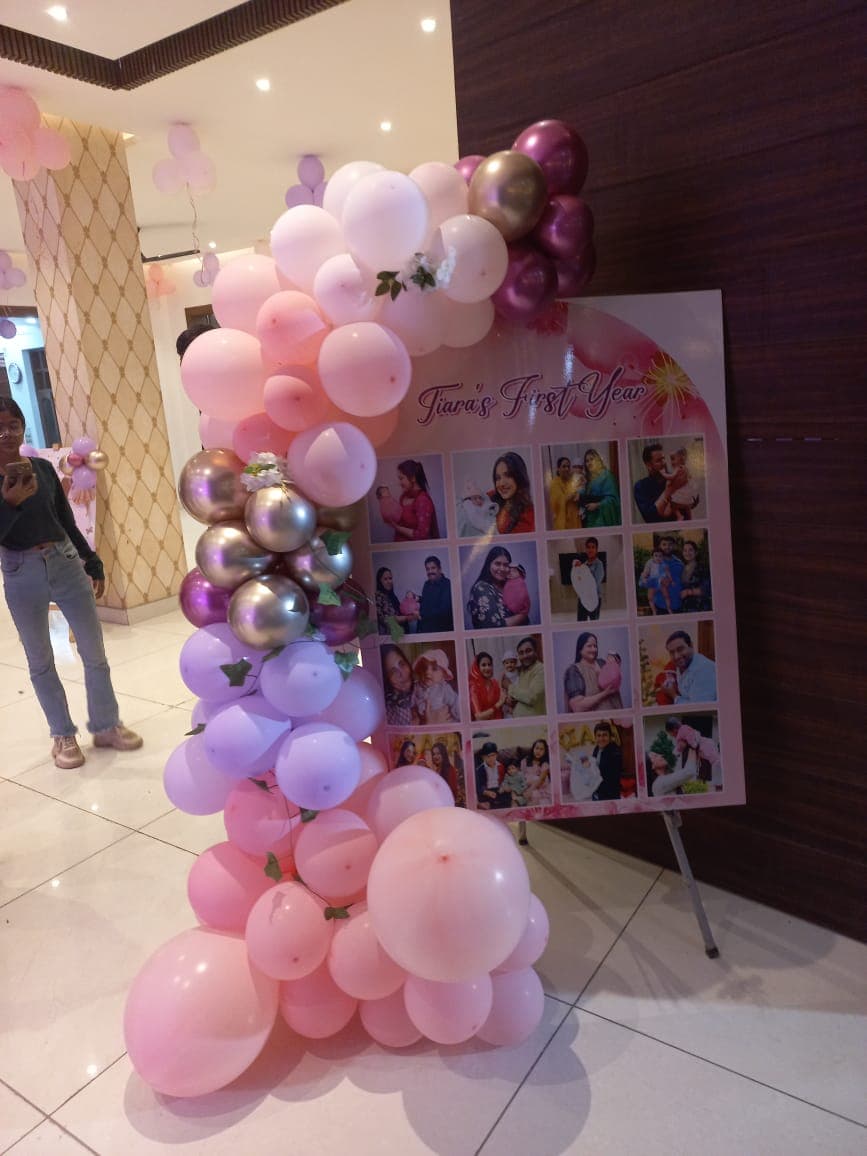 Tiara'S First Year Balloon Decor With Photo Collage Board