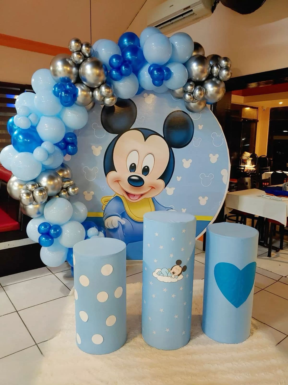 Baby Mickey Mouse Balloon Decor With Themed Pedestals And Blue Arch