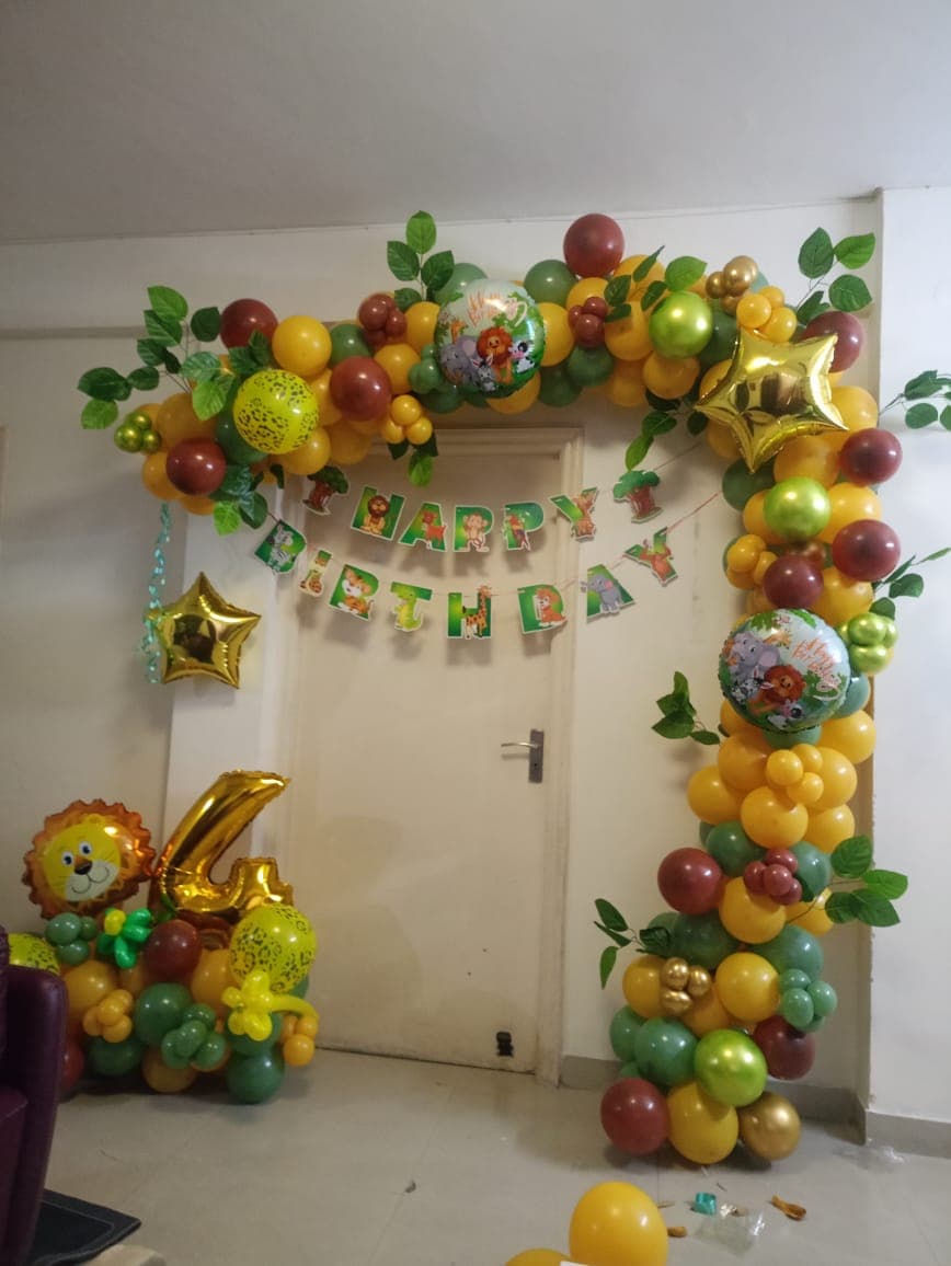 Jungle Theme Fourth Birthday Balloon Decor With Lion And Animal Prints