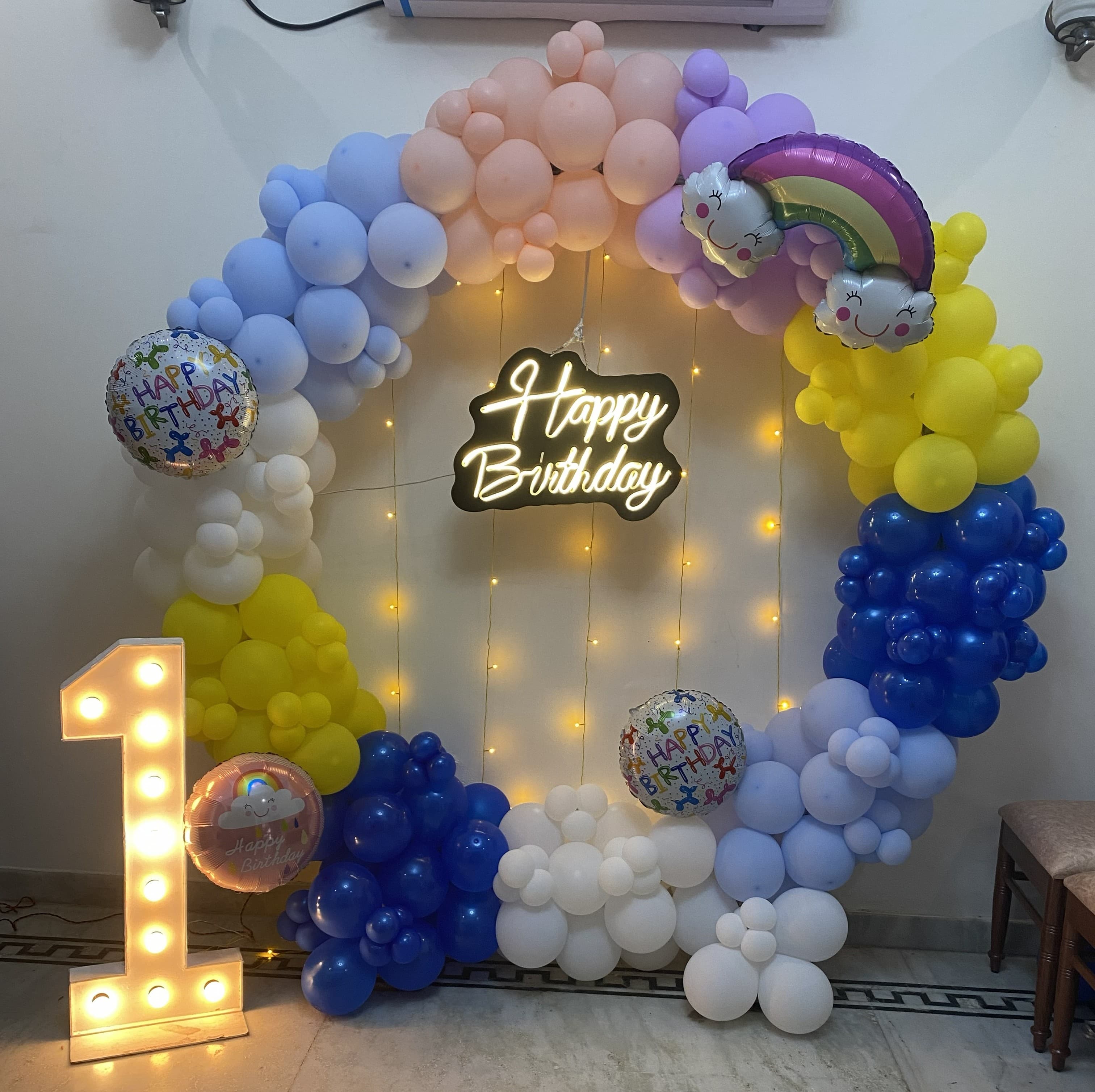 Rainbow Pastel First Birthday Balloon Decor With Cloud Accents