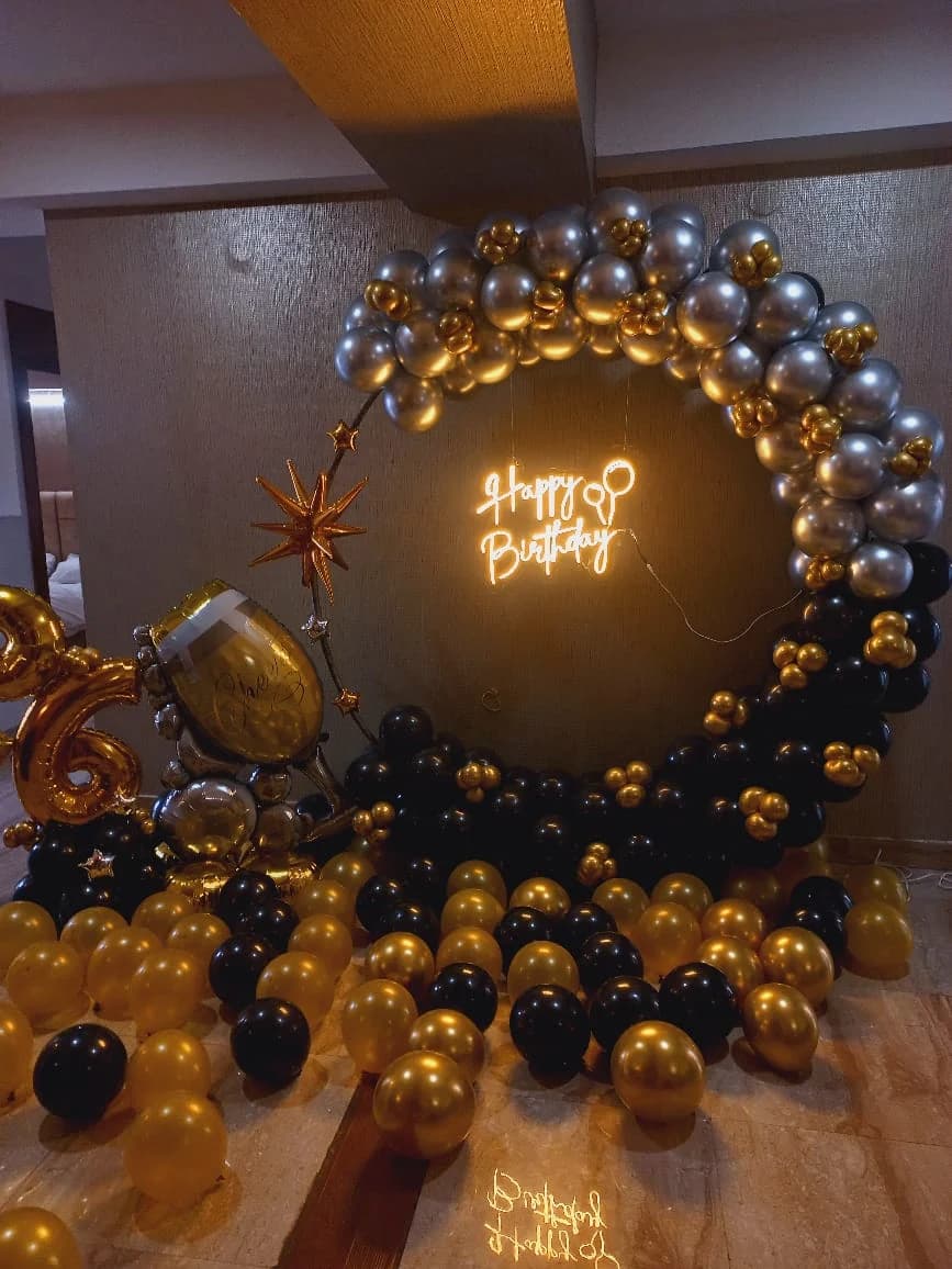 Elegant Black Gold Birthday Balloon Decor With Metallic Ring Arch And Neon Happy Birthday Setup